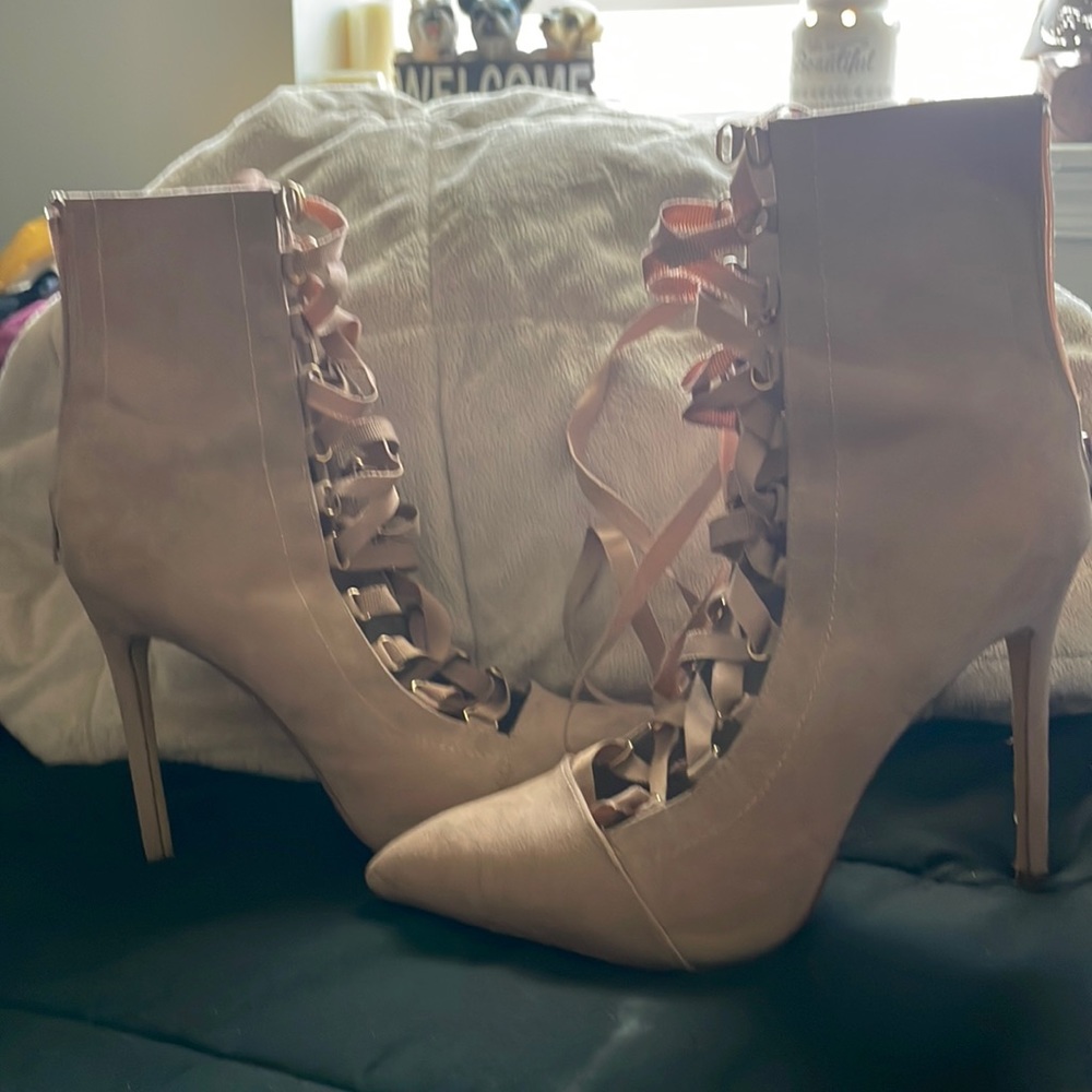 New barely used sexy tie up heels size 9 but for an 8 because of the pointy toe